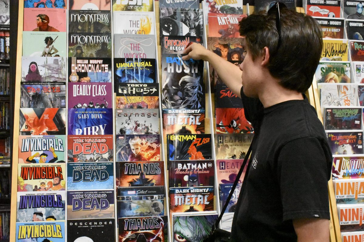 Comic book enthusiast Shawn Hering browsing comic books.