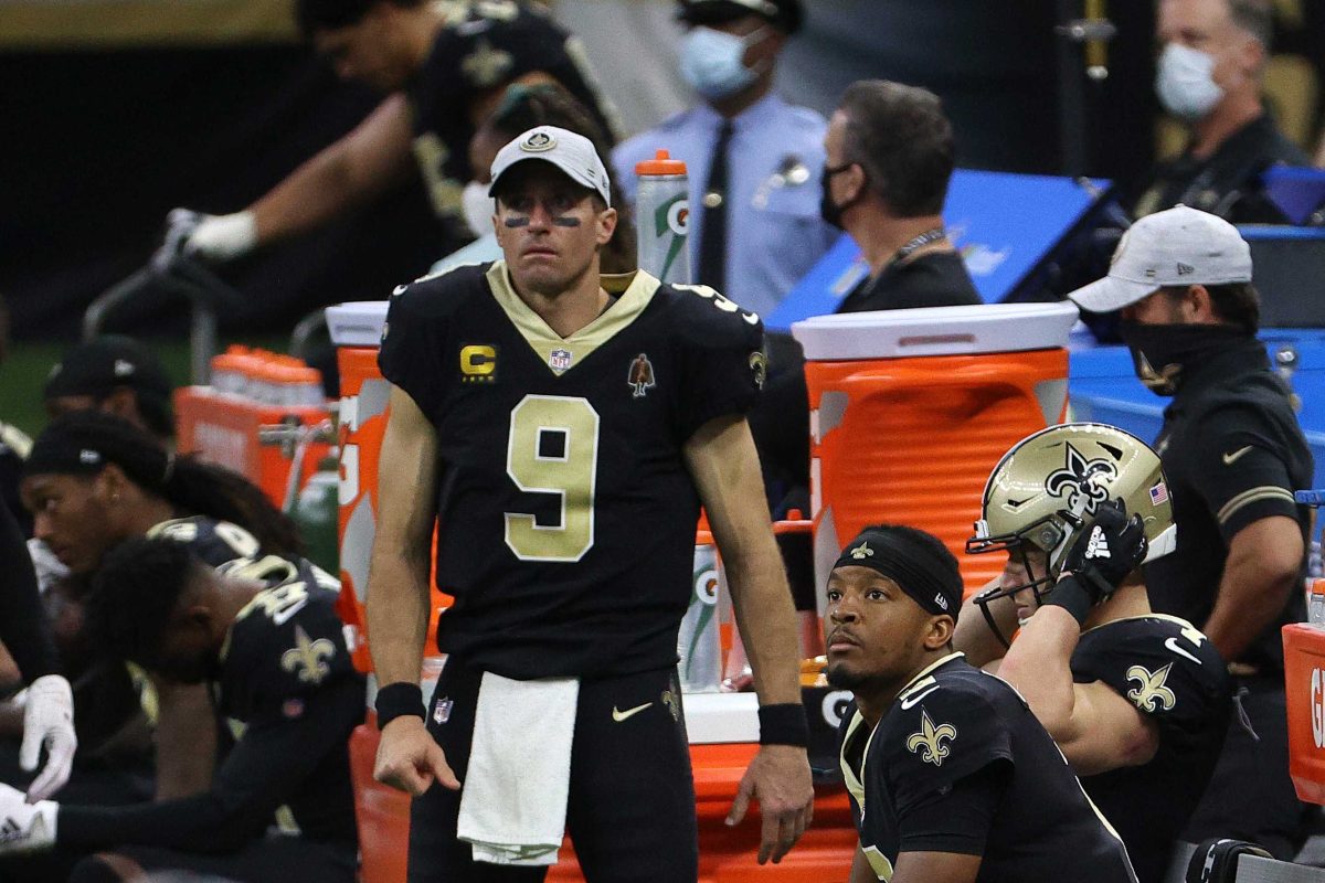 Drew Brees #9 and Jameis Winston #2 of the New Orleans Saints look on from the sideline during their game against the San Francisco 49ers at Mercedes-Benz Superdome on Nov. 15, 2020 in New Orleans, Louisiana. Brees suffered multiple rib fractures and a collapsed lung during the game. (Chris Graythen/Getty Images/TNS)