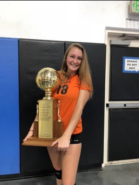 Palomar Athlete Courtney Hoffman holds a trophy.