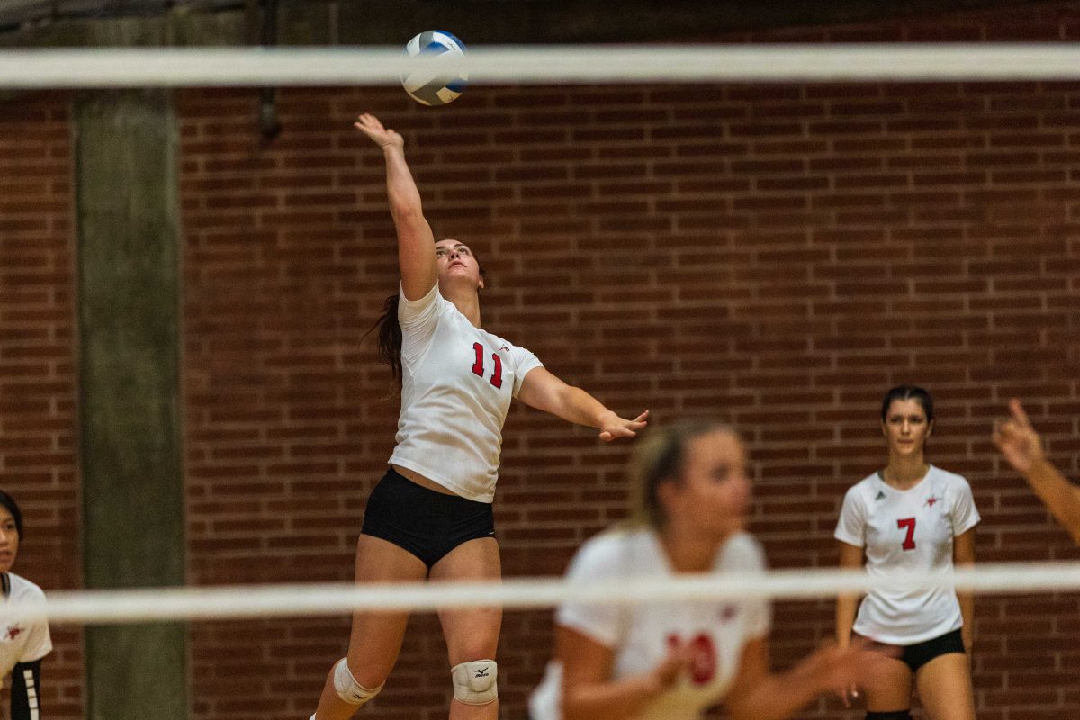 A female volleyball player hits the ball during a game in September 2021.