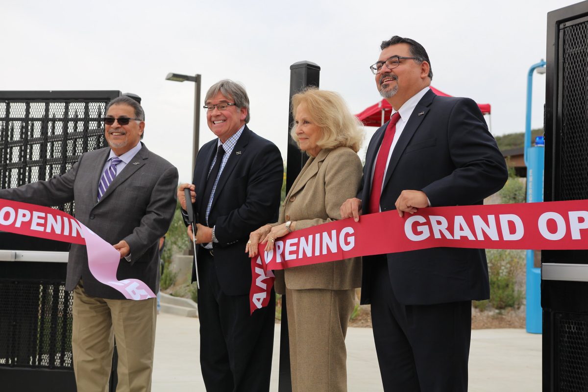 Mark Evilsizer cuts the ribbon at the grand opening of the new baseball field with John Halcón (l) and Nancy Chadwick and Interim President Adrian Gonzales to his left. (Michaela Sanderson/The Telescope)