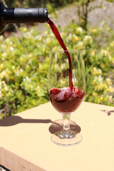 Pouring a bottle of Toast Oak wine. (Giovanni Vallido/IMPACT Magazine)
