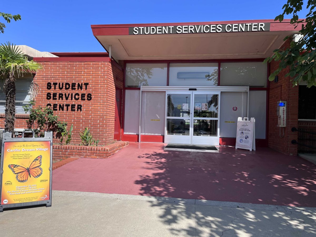 A photo of a brick building with Student Services Center on the wall of the building.