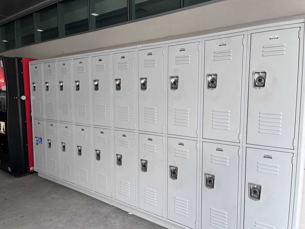 A row of lockers line the wall of a building.