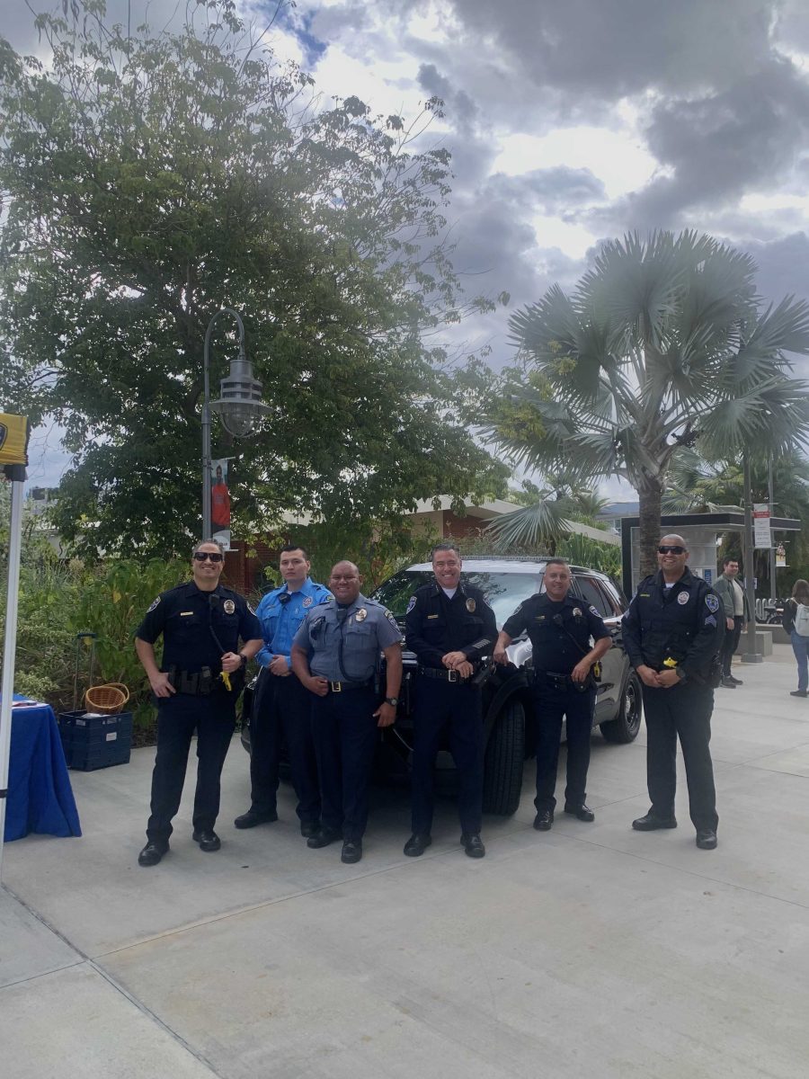 The Palomar Campus Police pose infront of one of their cruisers.