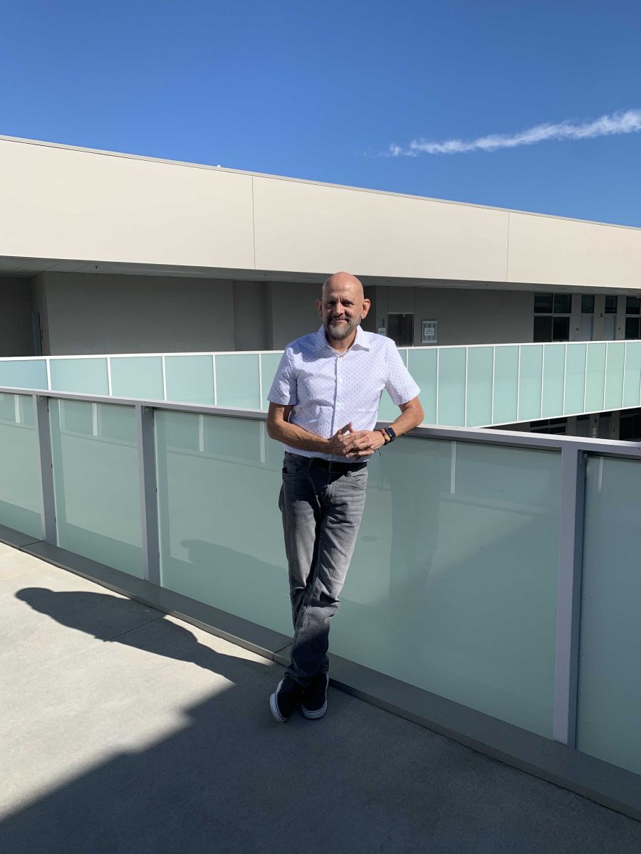 Alex Gómez poses for a photo on the third floor of the MD building at Palomar's San Marcos campus. Photo credit: Elizabeth Rivera Guevara