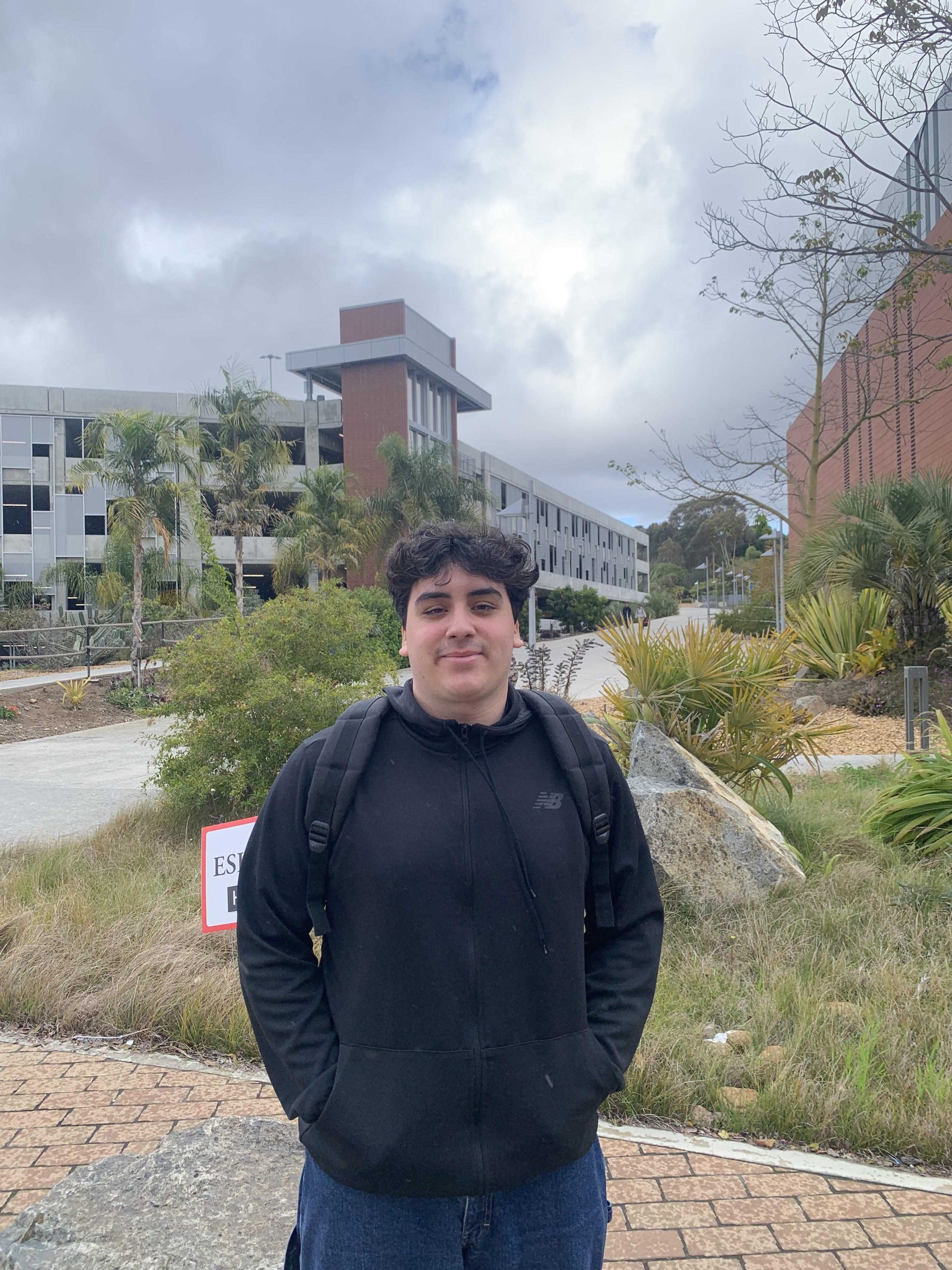 Chris Flores poses for a photo in front of the Palomar LRC. Photo credit: Quinton Hayek Photo credit: Quinton Hayek