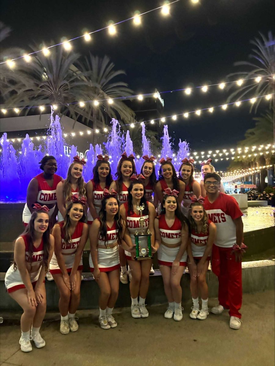 The Palomar Cheer team gathers together to pose for a picture with their third place trophy. Photo courtesy: Coach Stephanie Neptune Reed