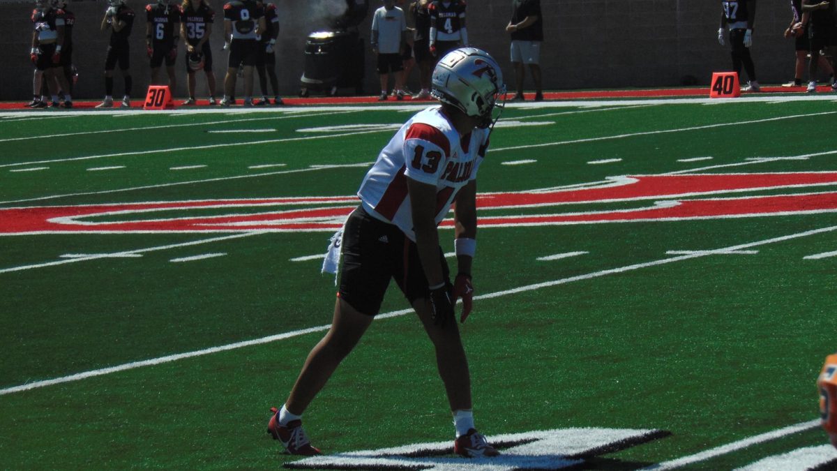 Ka'alei Apana, a wide receiver for Palomar's football team, lines up for a pre-snap on the new football field.