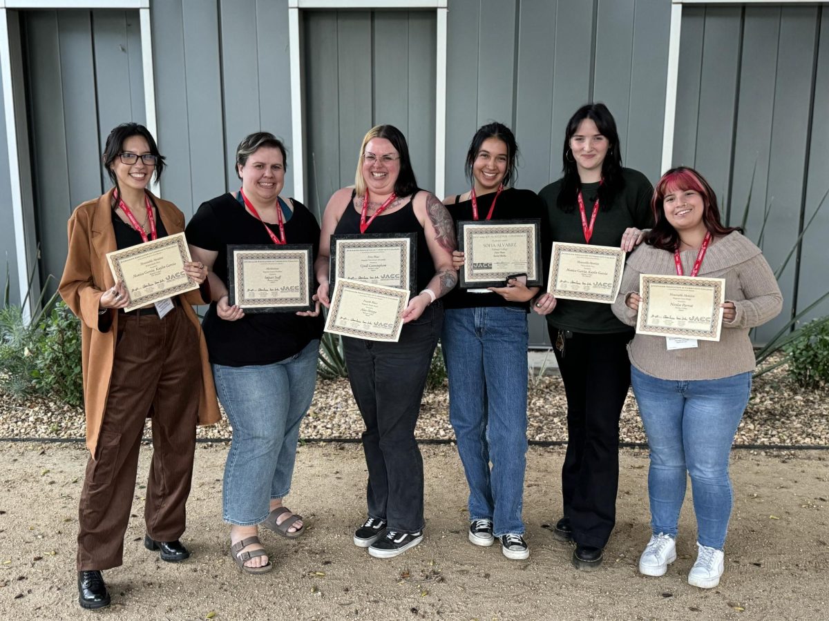 (From left to right) Monica Garia, Victoria Gudmundson, Cyndi Cunningham, Sofia Alvarez, Annabelle Williams, and Elizabeth Aguilar posing with awards outside of Kurland Lecture Hall at CalState Northridge.