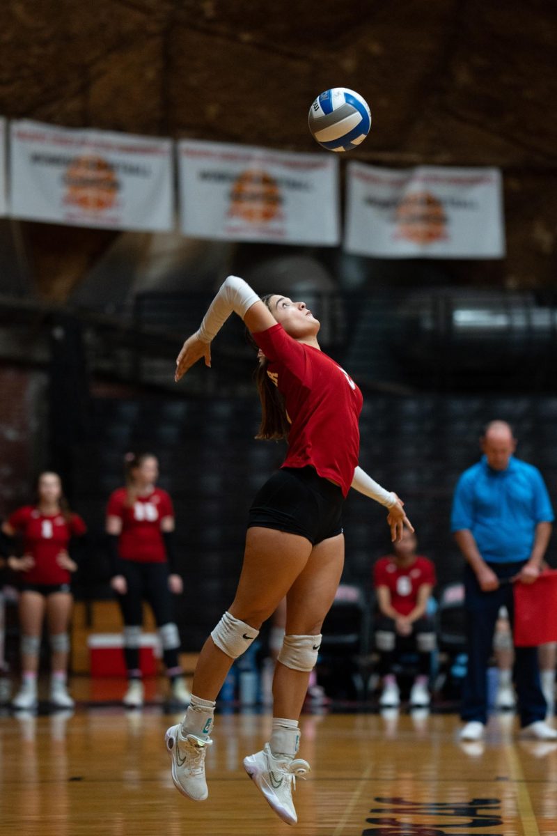 Palomar's woman's volleyball player #5 Janell Spires serving the ball during a match against Cuyamaca.