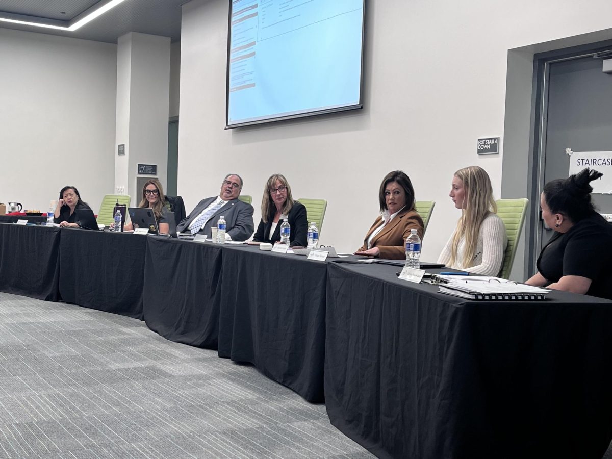 (Left to right) Governing Board Trustees Judy Patacsil, Yvette Acosta, Roberto Rodriguez, Holly Hamilton-Bleakley, Jacqueline Kaiser sit with Student Trustee Reagan Barnum and Superintendent/President Star Rivera-Lacey at the Governing Board meeting on Dec. 17.