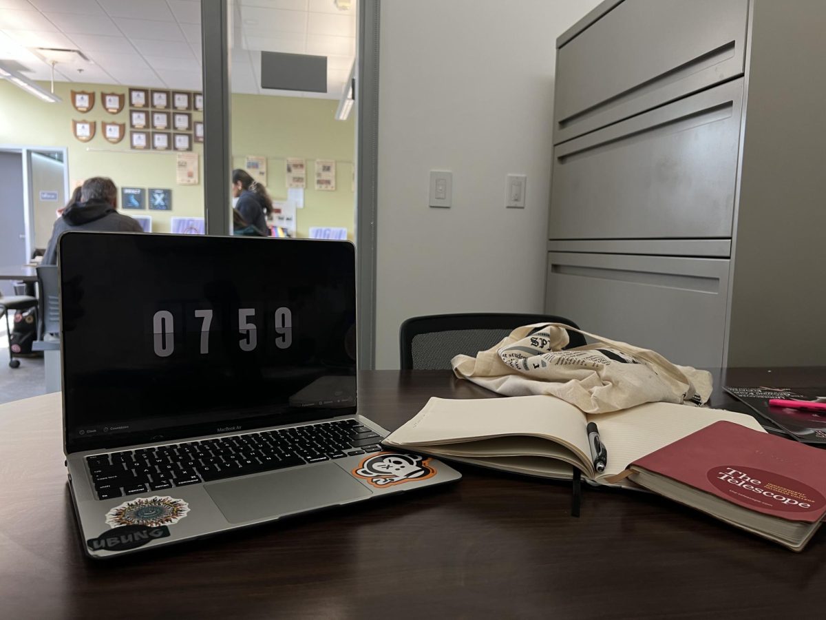 A laptop displaying 7:59 AM sits on a quiet desk, moments before an 8 AM class begins. A reminder of the early start that disrupts student’s sleep, focus, and overall performance. Photo credit: Annabelle Williams