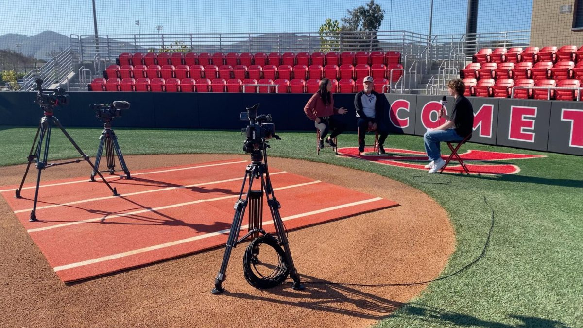 Connor Larson in an interview with softball coaches Lacey Craft and Mark Eldridge Photo credit: Connor Larson
