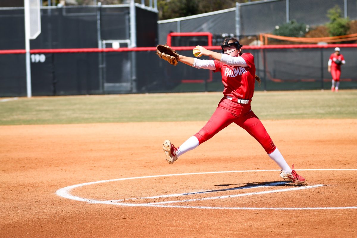 Maddie Bedolla winding up to throw a pitch.