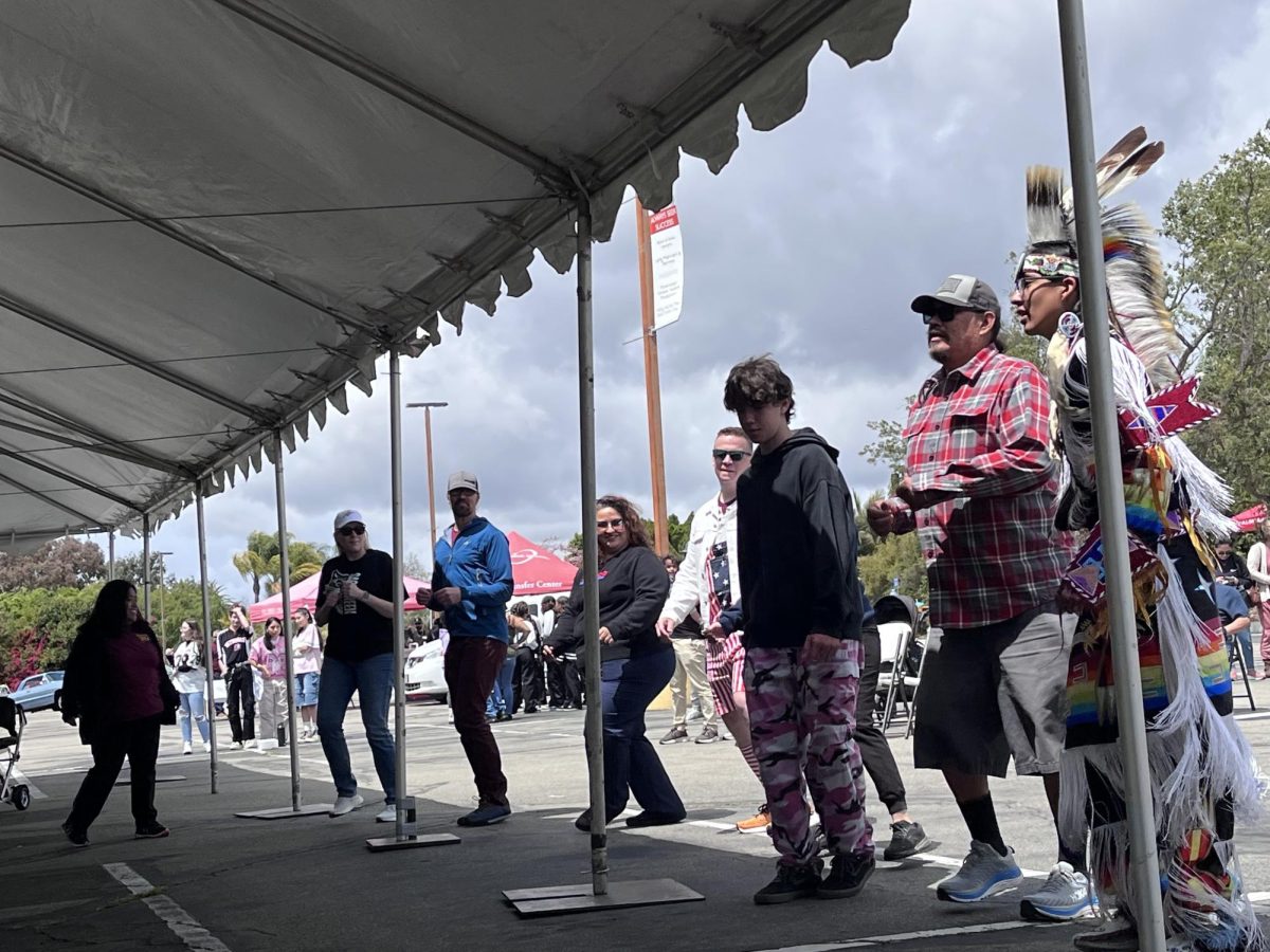 Tomas Quetzal De Crane (right), of the K'iché Maya/Crow/Navajo nations, led students and faculty in a dance to celebrate community at the Solidarity and Strength Festival on April 26 at Palomar College.