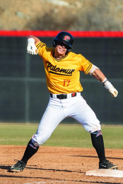 Palomar catcher Carter Jorissen celebrates with an arm pump after reaching safely at first.