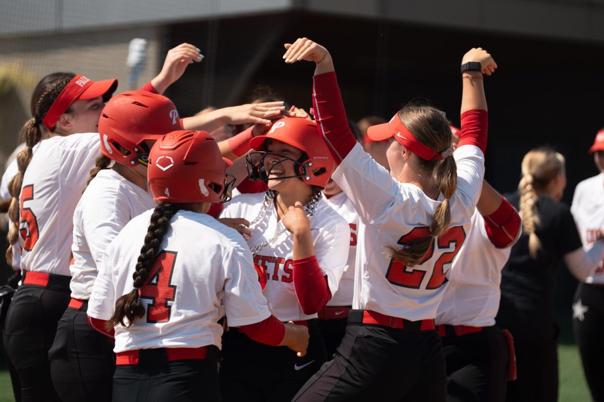 Center Fielder #1 Gisele Gonzalez surrounded by teammates after her solo home run against College of the Canyons on May 2 in San Marcos.