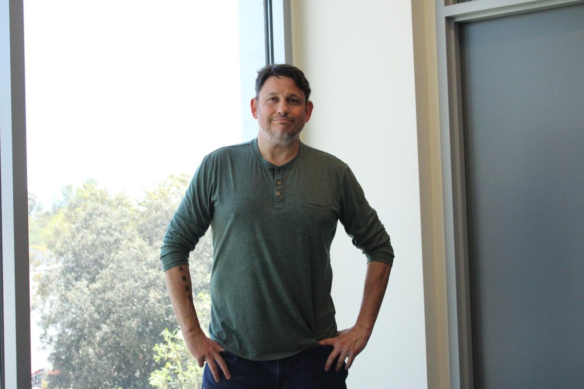 Peter Bowman, a political science professor at Palomar College, poses for a photo in the MD Building on the San Marcos campus. Bowman recently spoke with The Telescope about the state of democracy under the Trump administration.