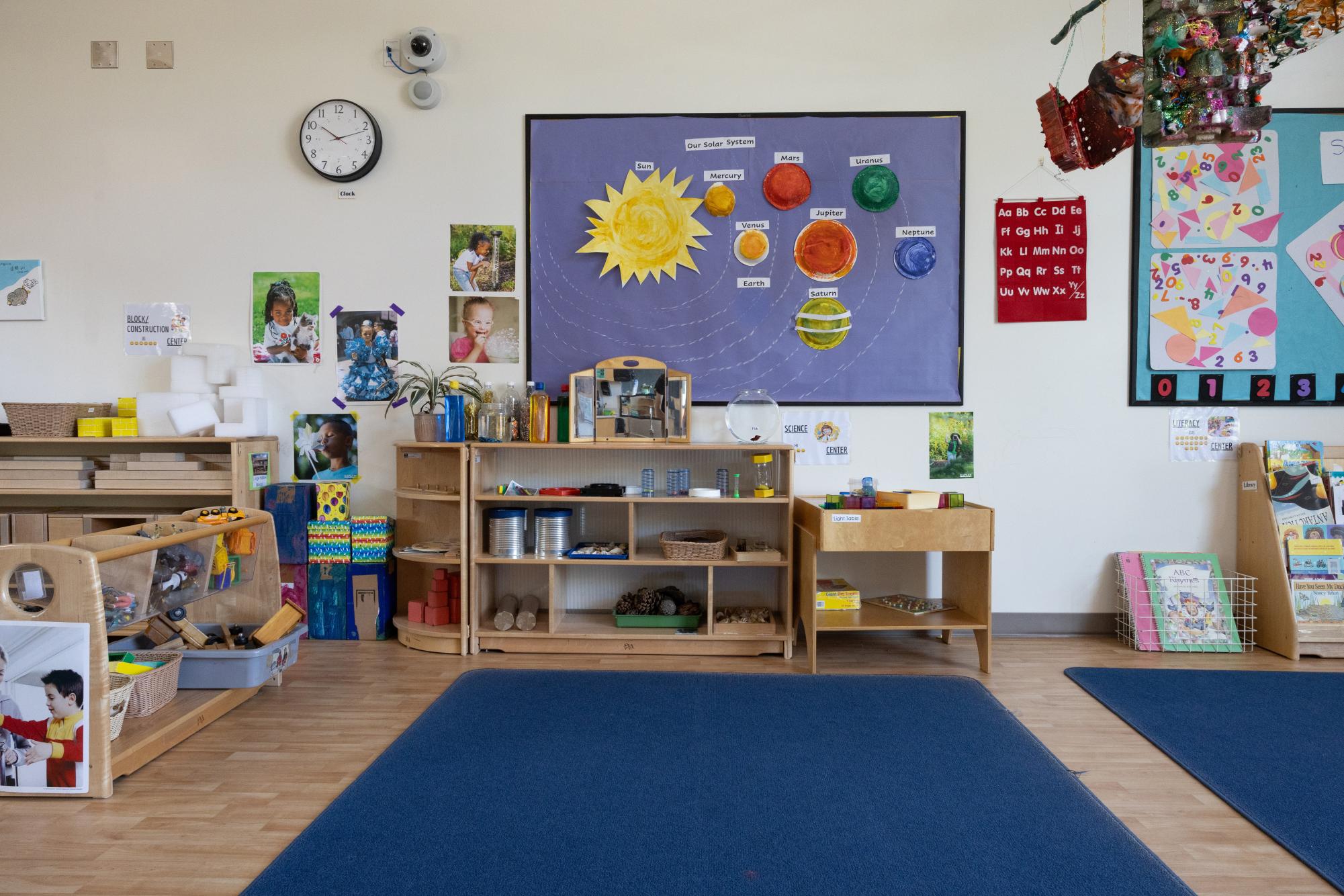 Shelves and wall decoration of the solar system located in preschool classroom at Palomar College campus in San Marcos, California, April 8, 2025.