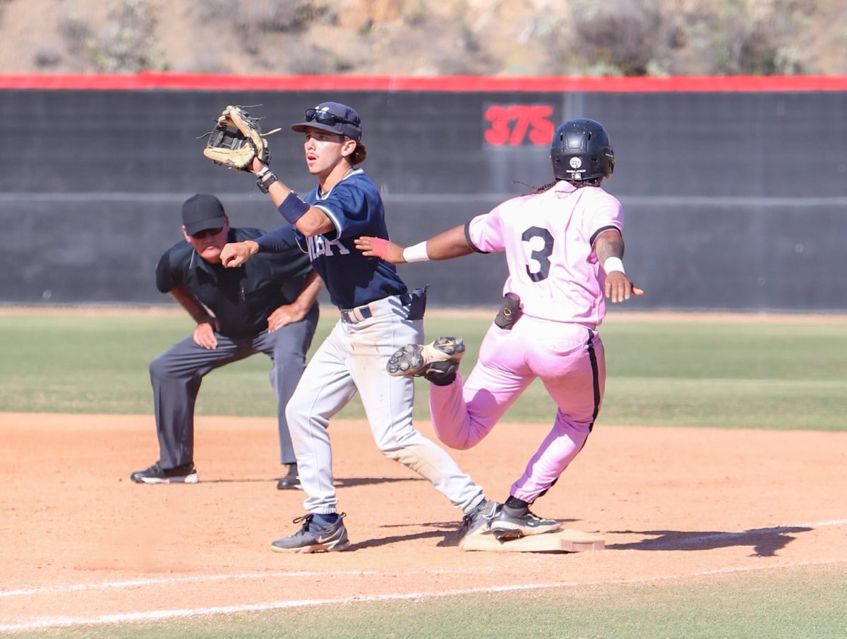 Center fielder #3 Justin Tucker runs through first base. Tucker was called safe. Photo credit: Lexi Thurman