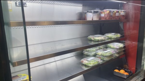 The refrigerated shelves at the cafe two thirds of the way empty with only some salads and yogurt parfaits left.