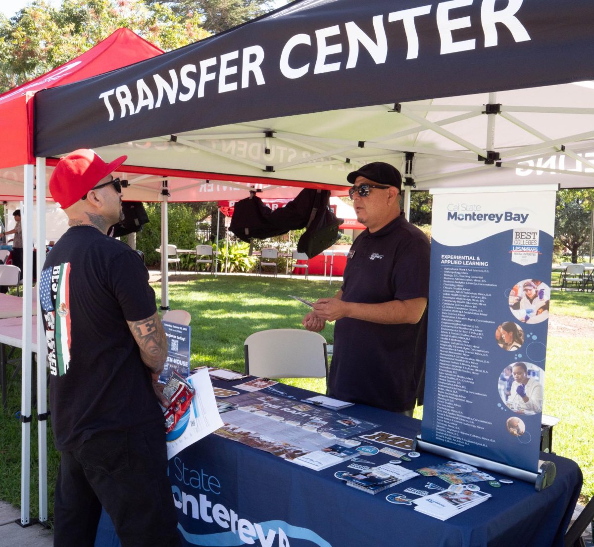A Palomar student speaks with a representative from California State University, Monterey Bay, at the college fair on October 7, 2025, at Palomar College. 