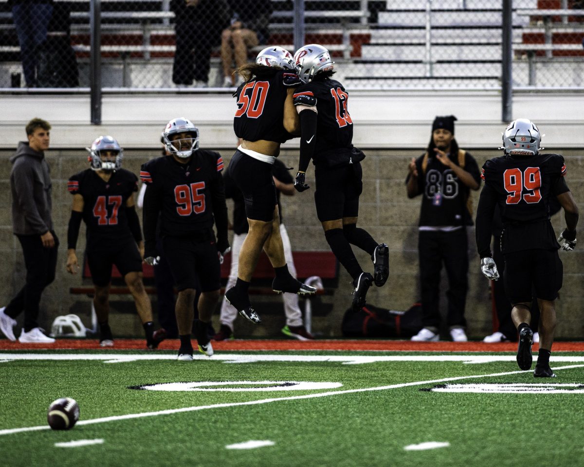 Palomar College linebacker Matty Malepeai (#50) (right) celebrates a recovered fumble with defensive back Bubba Garcia (#13) early in the first quarter against Saddleback College on Oct. 25 2025 at the Palomar College Stadium. Photo credit: Evan Odom