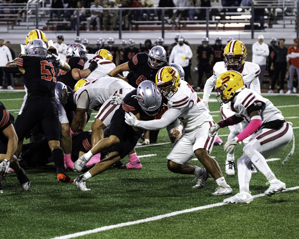 Palomar College running back Chris Bausch (#21) pushes past Saddleback College defensive back Jaden Humphrey (#29) and linebacker Orlando Gonzalez (#34) on Oct 25 2025 at the Palomar College Stadium. Photo credit: Evan Odom