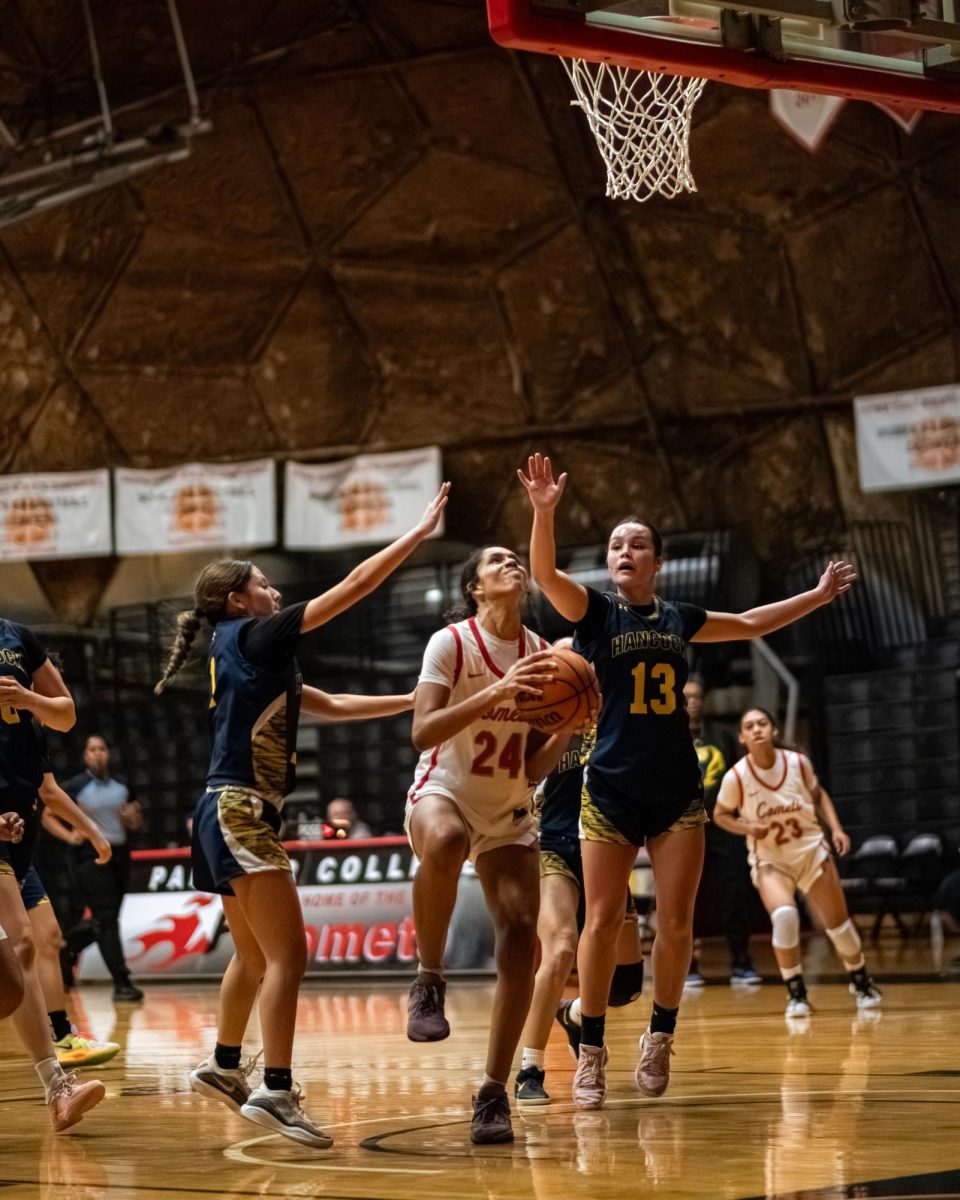 Palomar College guard Ivorii Seals (#24) pushes through Allen Hancock College guards Daviana Chavez (#1) and Monserat Campos (#13) to score early in the first quarter on Nov. 14 2025 at the Dome.