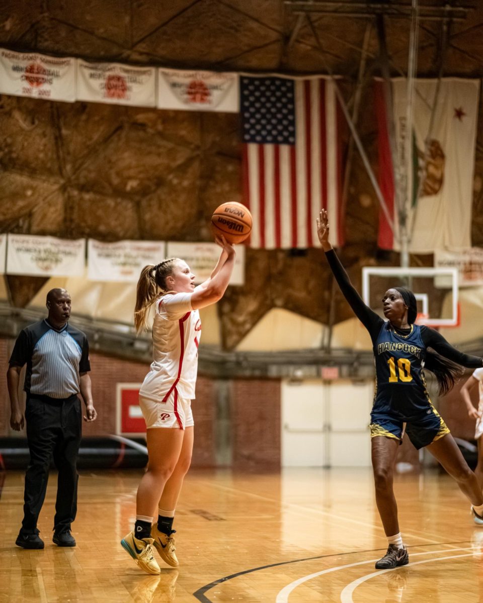 Palomar College guard Kami Gillis (#10) shoots a three pointer against Allen Hancock College guard Sophonnie Felix (#10) on Nov. 14 2025 at the Dome.