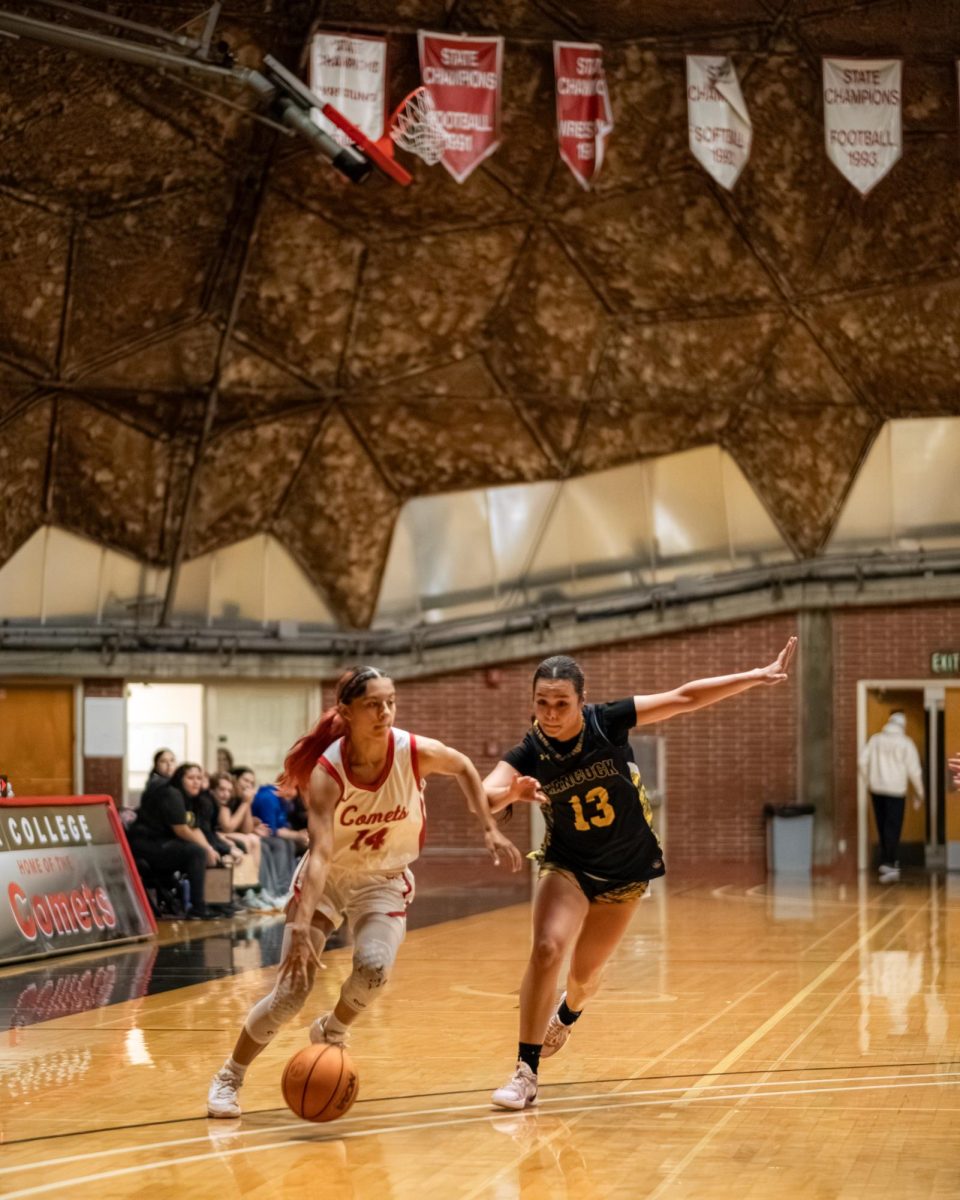 Palomar College guard Kylee Trujillo (#14) drives past Allen Hancock guard Moncerat Campos (#13) in the third quarter on Nov. 14 2025 at the Dome.
