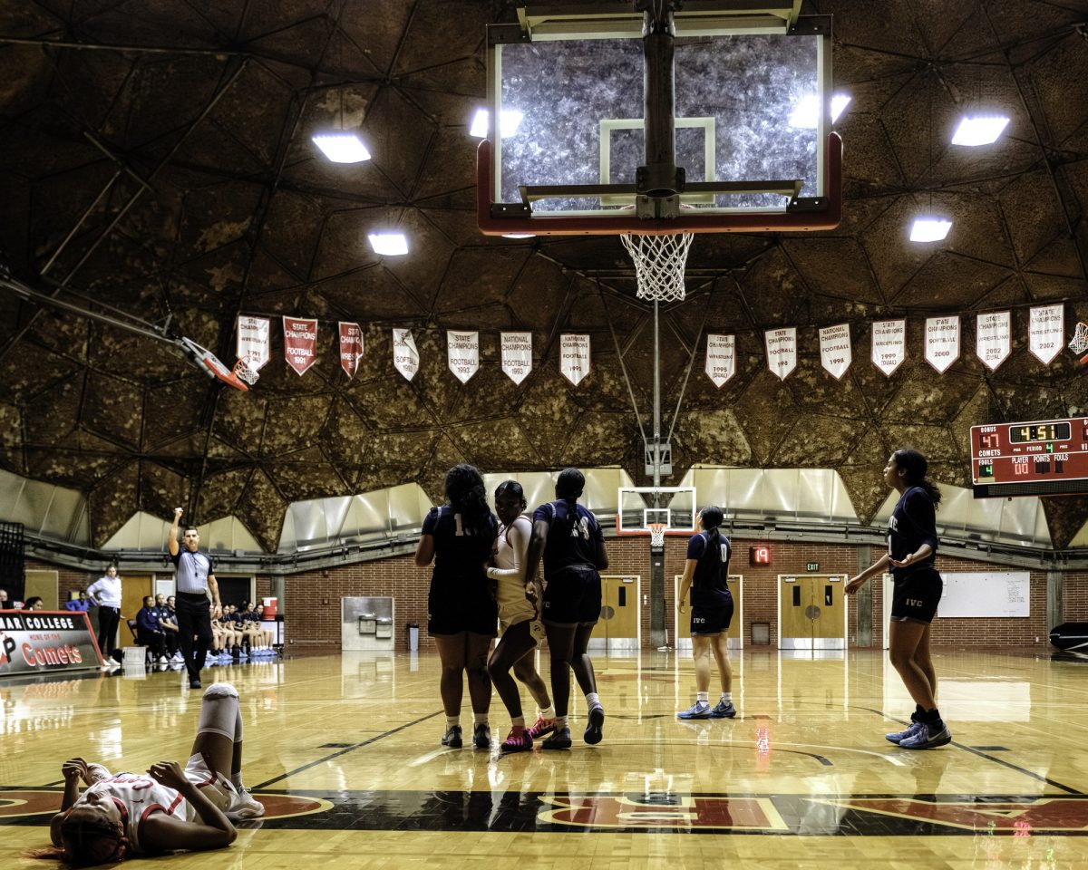 Palomar College guard Kylee Trujilo (#14) lies on the ground after driving to the basket against Irvine Valley College on Nov. 1 2025 at The Dome.