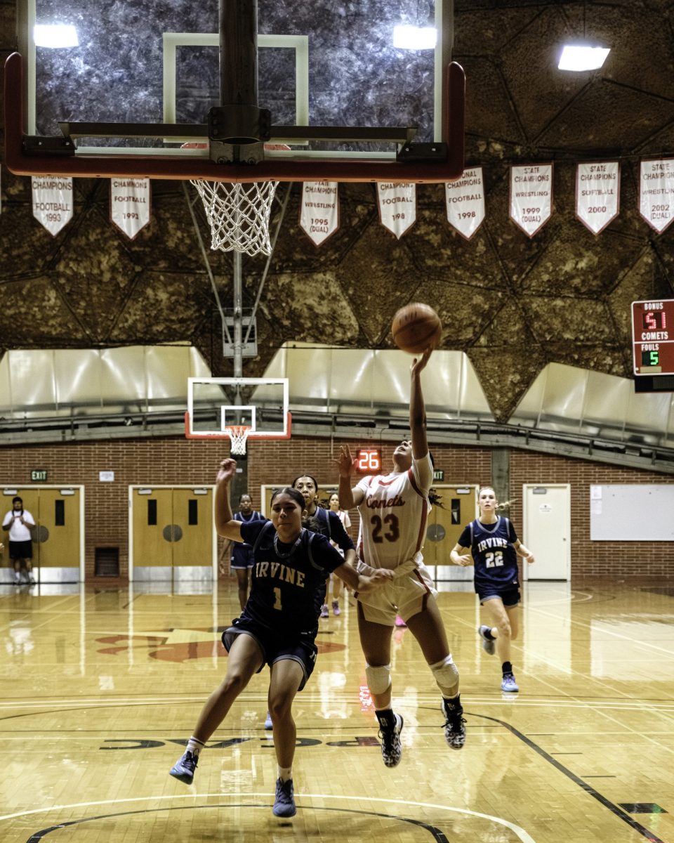 Palomar College guard Myla Jones (#23) lays up a breakaway drive against Irvine Valley College guard Princess Mendoza (#1) during the fourth quarter on Nov. 1 2025 at The Dome. Photo credit: Evan Odom