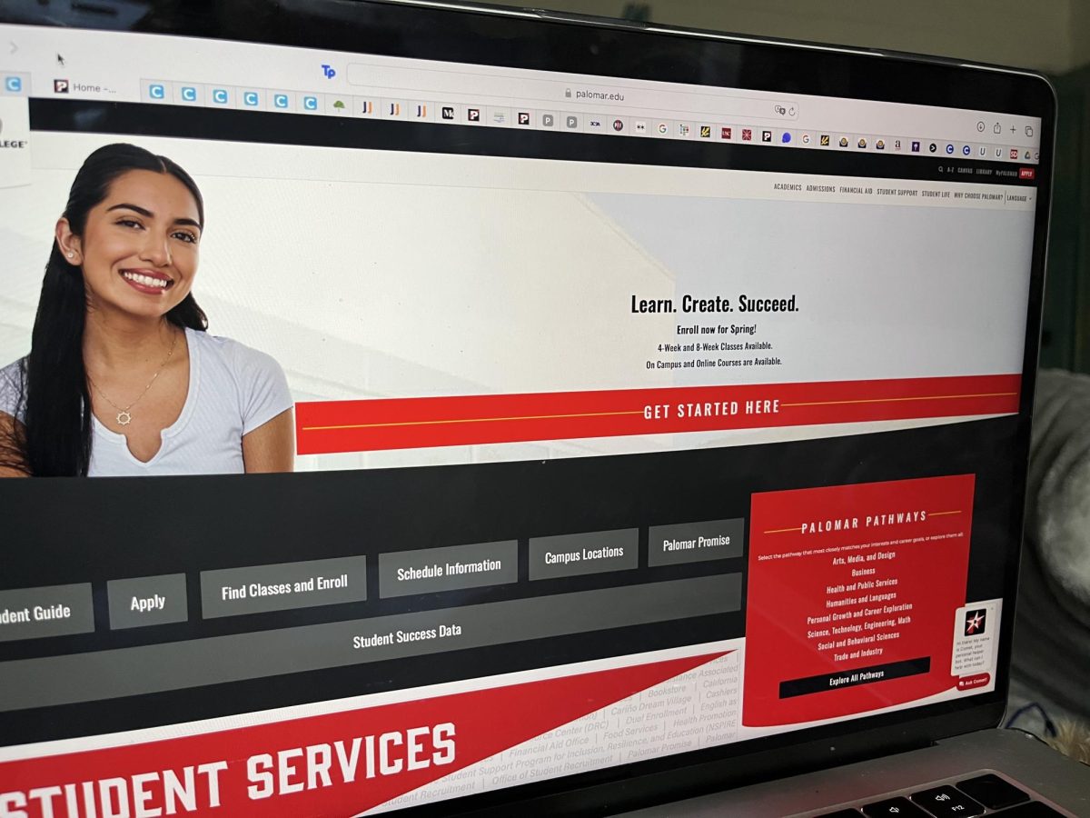 Photo of an open laptop displaying the Palomar College homepage, with the main banner and navigation menu visible. The image illustrates how the website appears clean on the surface but often sends students into a maze of outdated pages and broken or inconsistent information.