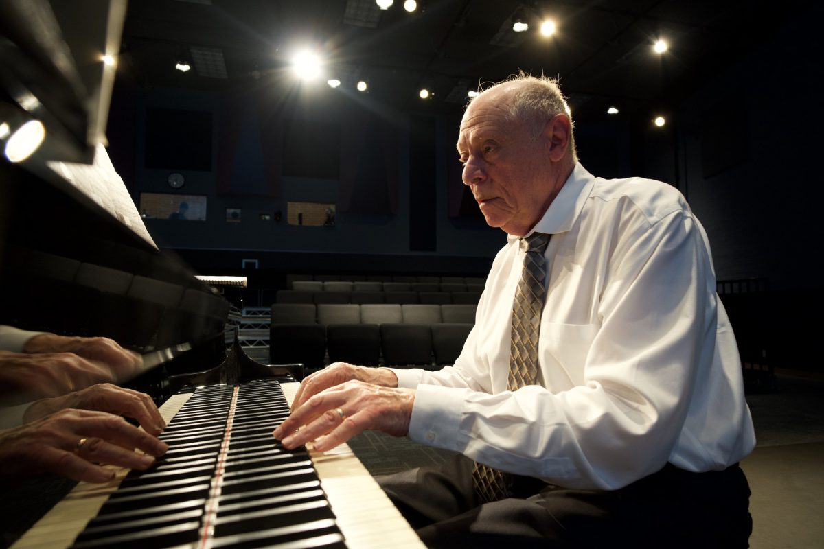 Dmitry Kirichenko plays piano under stage lights during Palomar College’s free Concert Hour series in the Performance Lab on Oct. 2, 2025.
