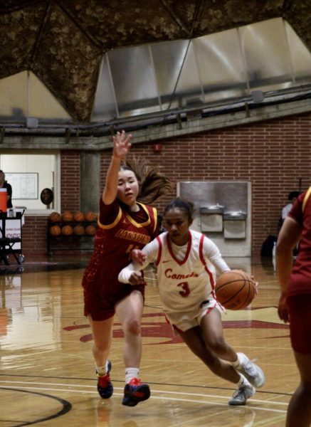 ReeRee Davis dribbles the ball away from a Pasadena player.