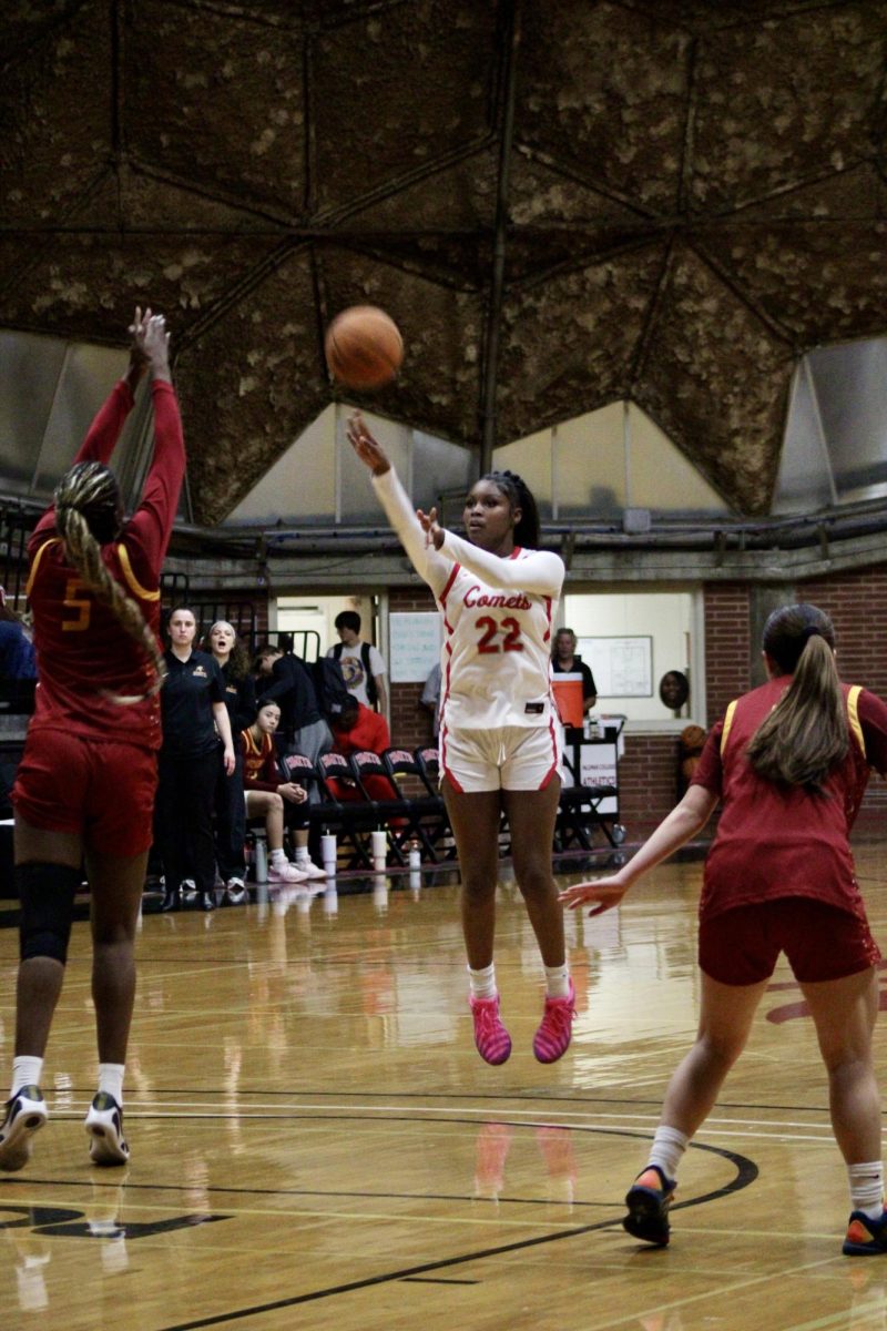 Kailani Flournoy (#22) shoots from the 3-point line.