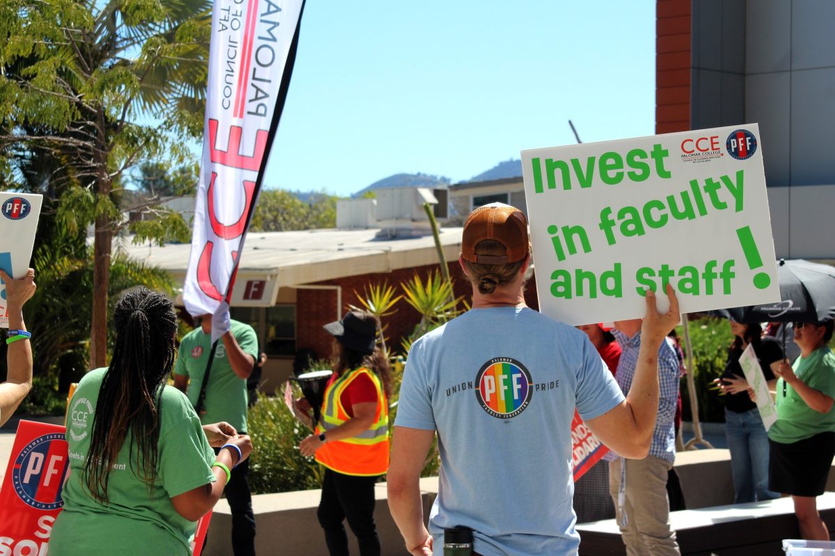 William Dalrymple (PFF Co-President) shows his support as Anel Gonzalez (CCE President) delivers her speech before the march on March 12, 2026 at Palomar College in San Marcos. 