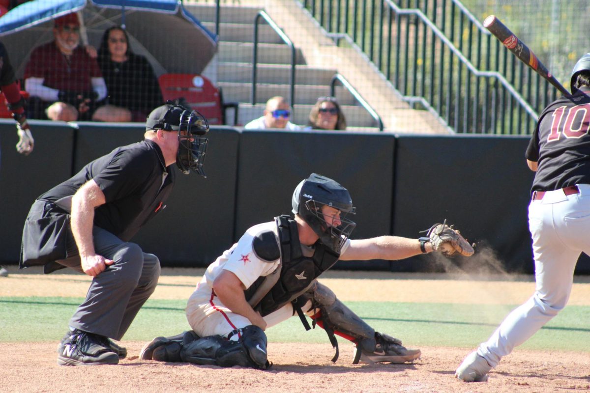 Catcher Rohan Brown (#17) clasps a fast pitch during a game against Southwestern College on March 5 at Bob Vetter Field.