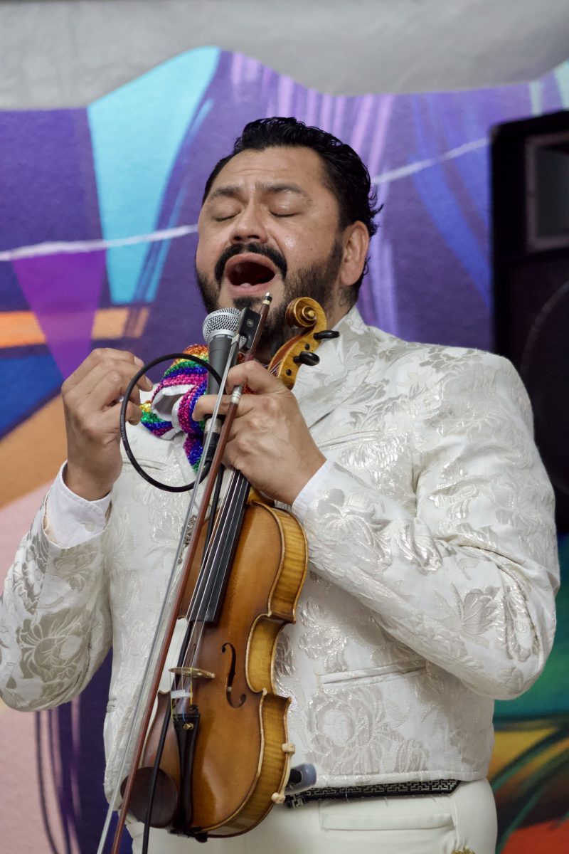 Ricardo Arzola, the violinist, sings "Como Quien Pierde Una Estrella" at the Pride Center grand opening event on April 2 at Palomar College.
