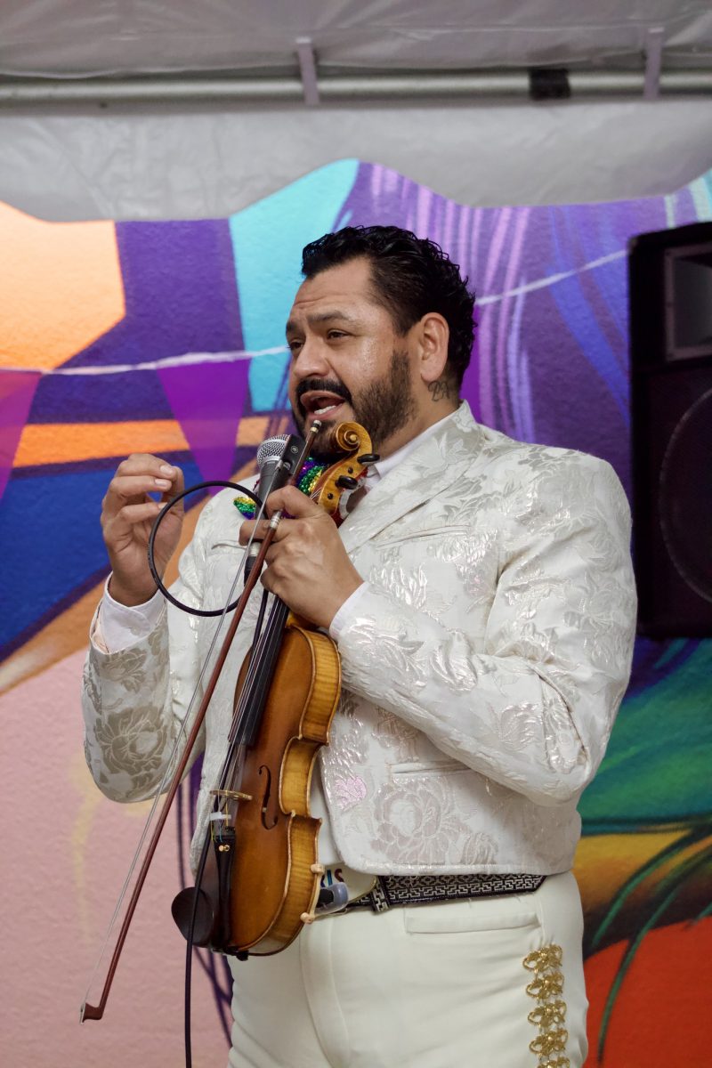 Ricardo Arzola, the violinist, sings "Como Quien Pierde Una Estrella" at the Pride Center grand opening event on April 2, 2026, at Palomar College. Photo credit: Griselda Garcia
