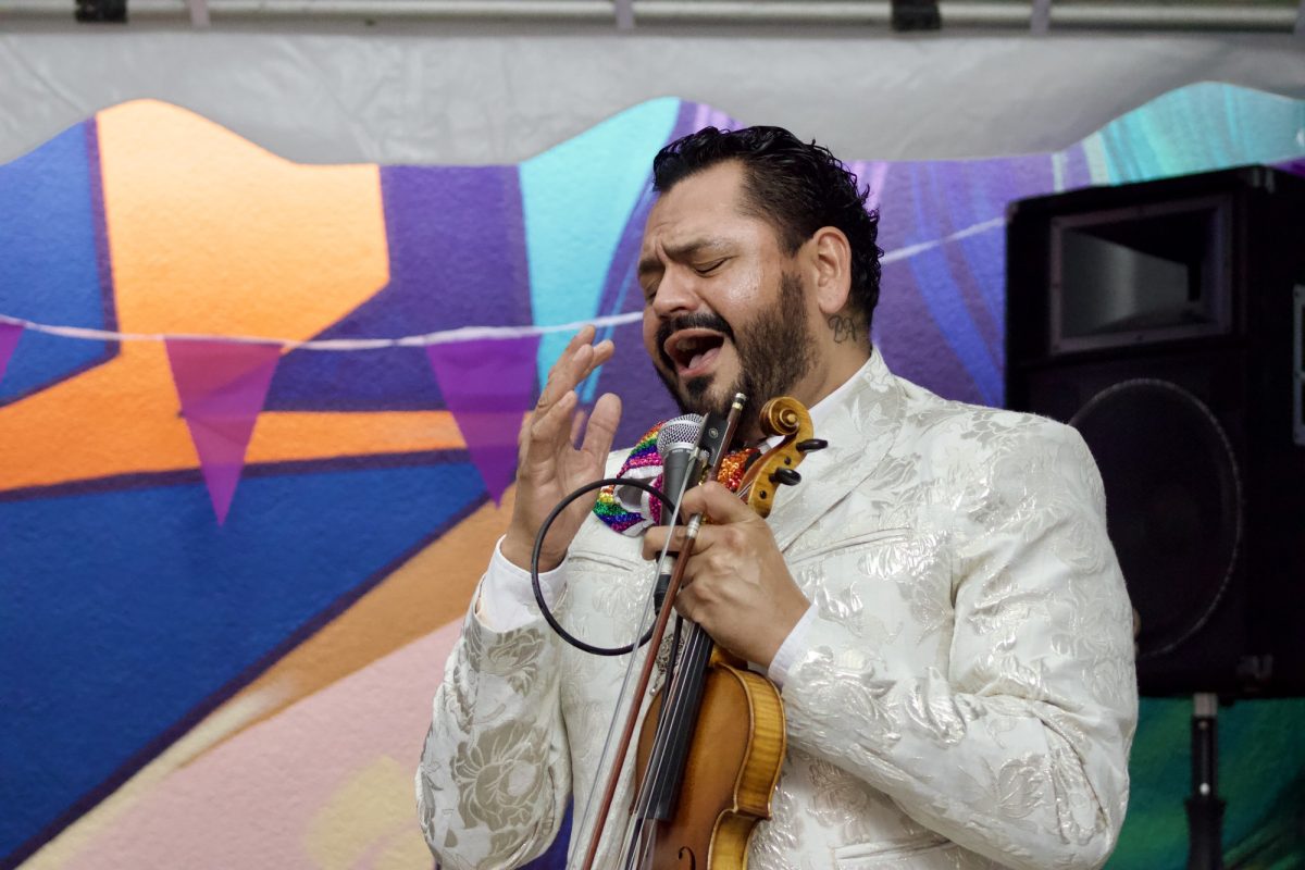 Ricardo Arzola, the violinist, sings "Como Quien Pierde Una Estrella" at the Pride Center grand opening event on April 2 2026 at Palomar College. Photo credit: Griselda Garcia