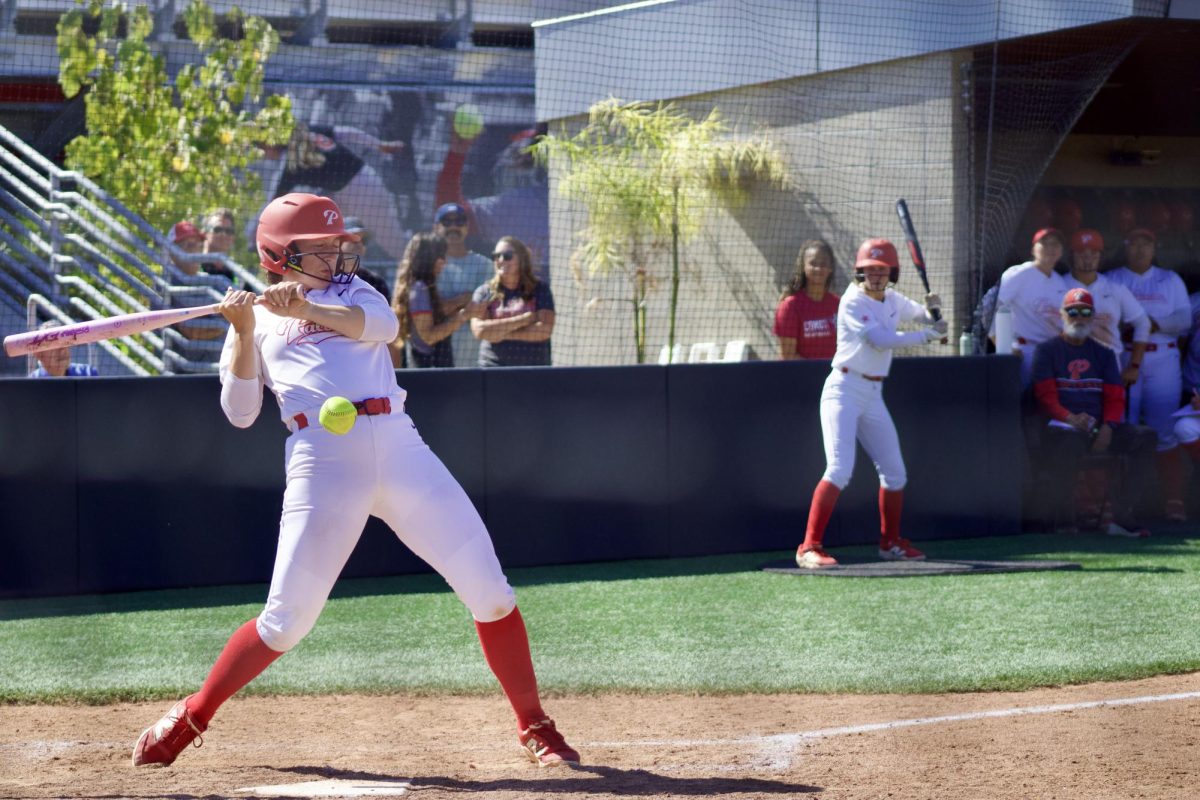 Alexis Huey gets hit on the wrist on an inside pitch to get to first base in the sixth inning of Game 1 of the 3C2A super regionals on May 8 at Palomar College. Huey dominated at the plate, going 2-for-3 with a two-run double and a two-run home run in the 8-4 Comet win.