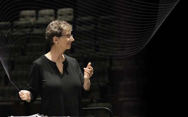 Ellen Weller conducts during a rehearsal with her purple baton, part of an initiative to recognize women conductors and leaders in March.